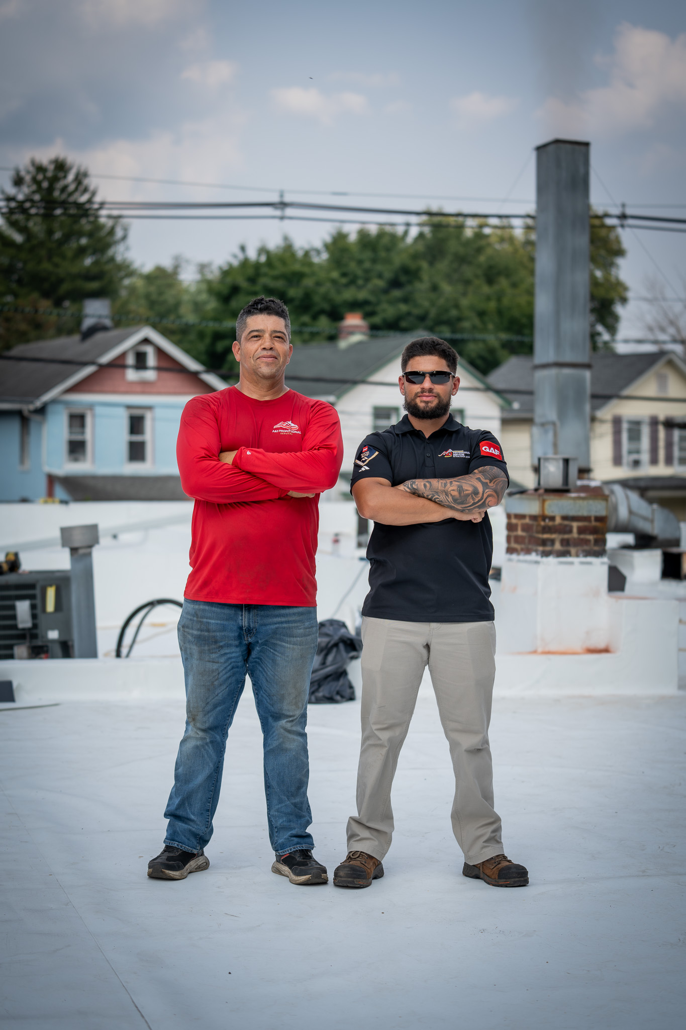 Christian and the A&J Professional Services crew on a completed commercial flat roof