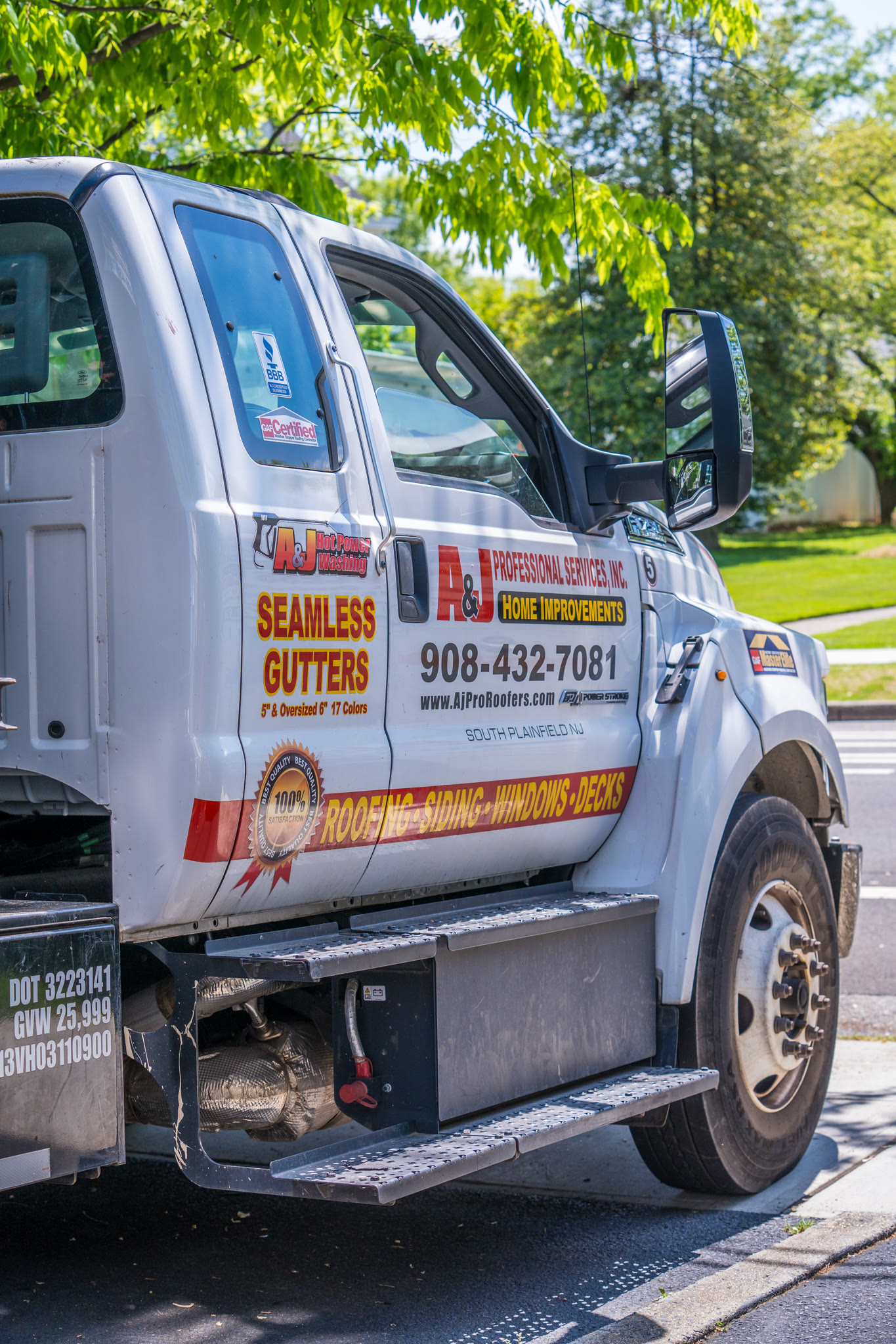 A&J service truck lettered "Seamless Gutters, 5 inch and oversized 6 inch, 17 colors"