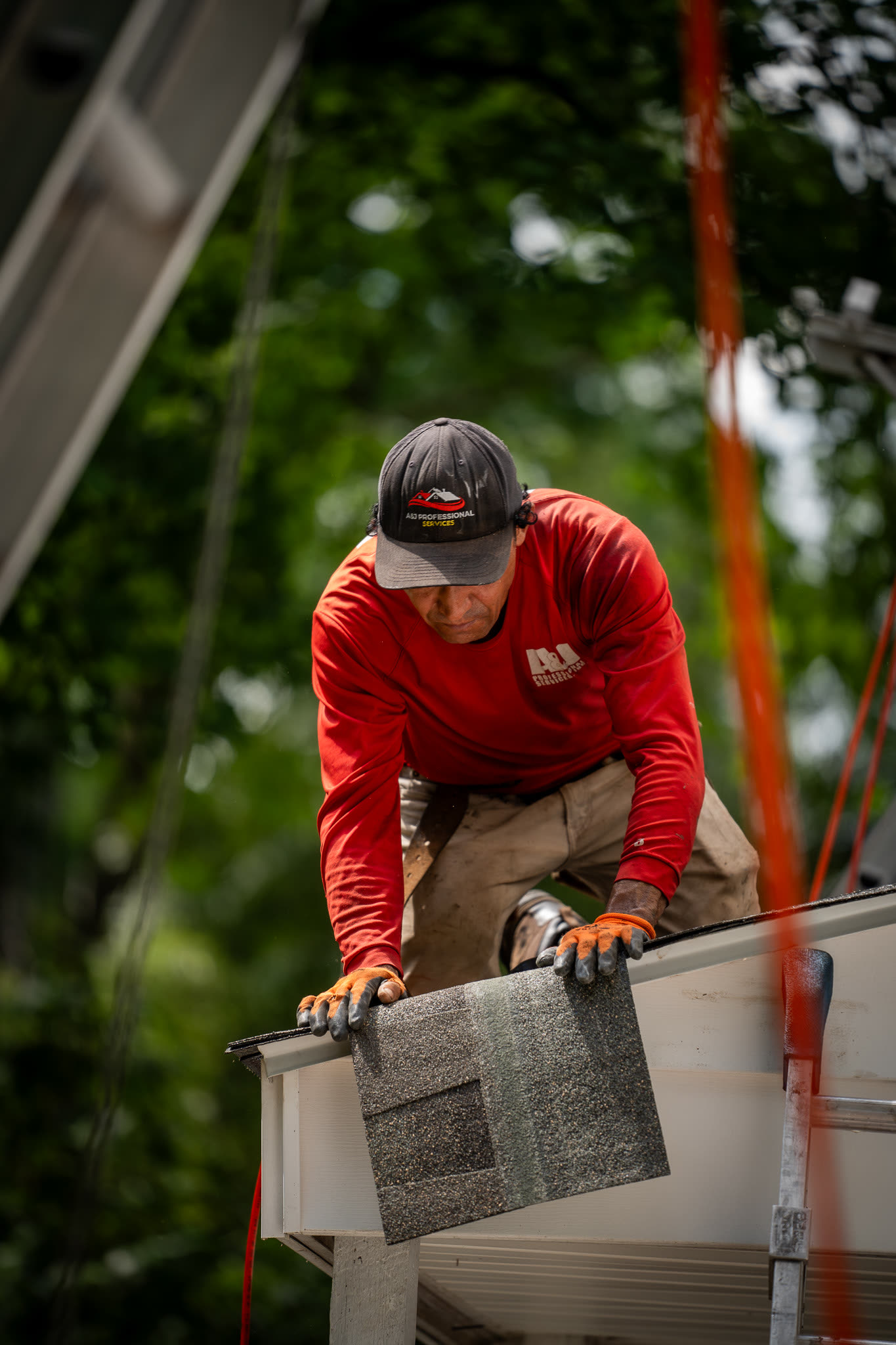 Crew working a lift on a roofing job